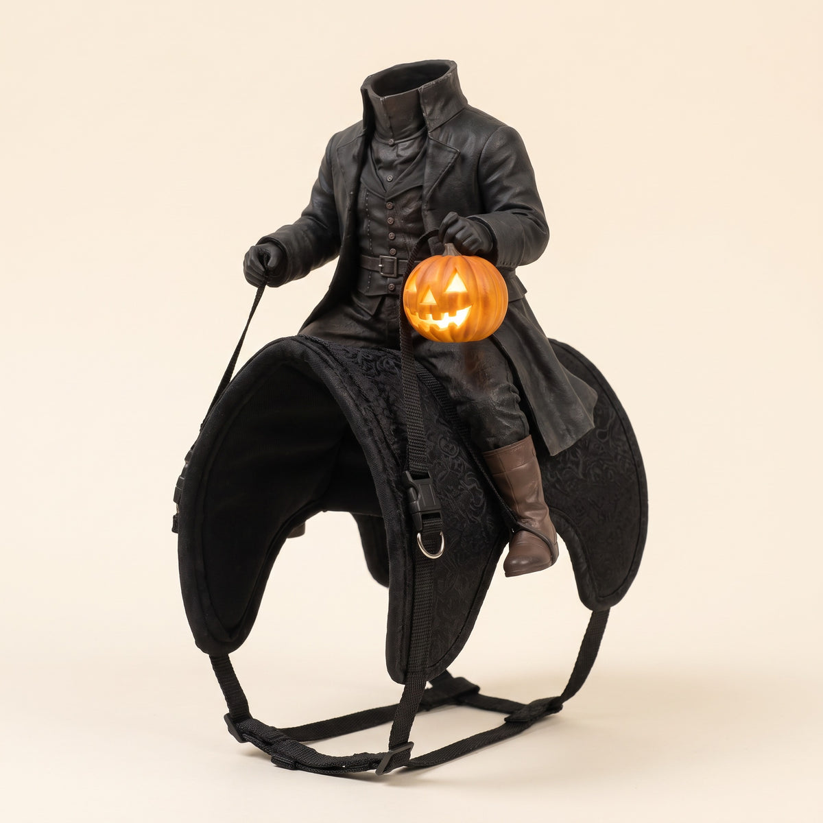 The headless rider and saddle on their own, with the jack-o'-lantern lit