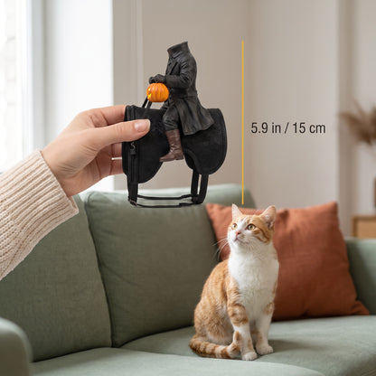 The 5.9 inch rider held in hand next to a cat for scale